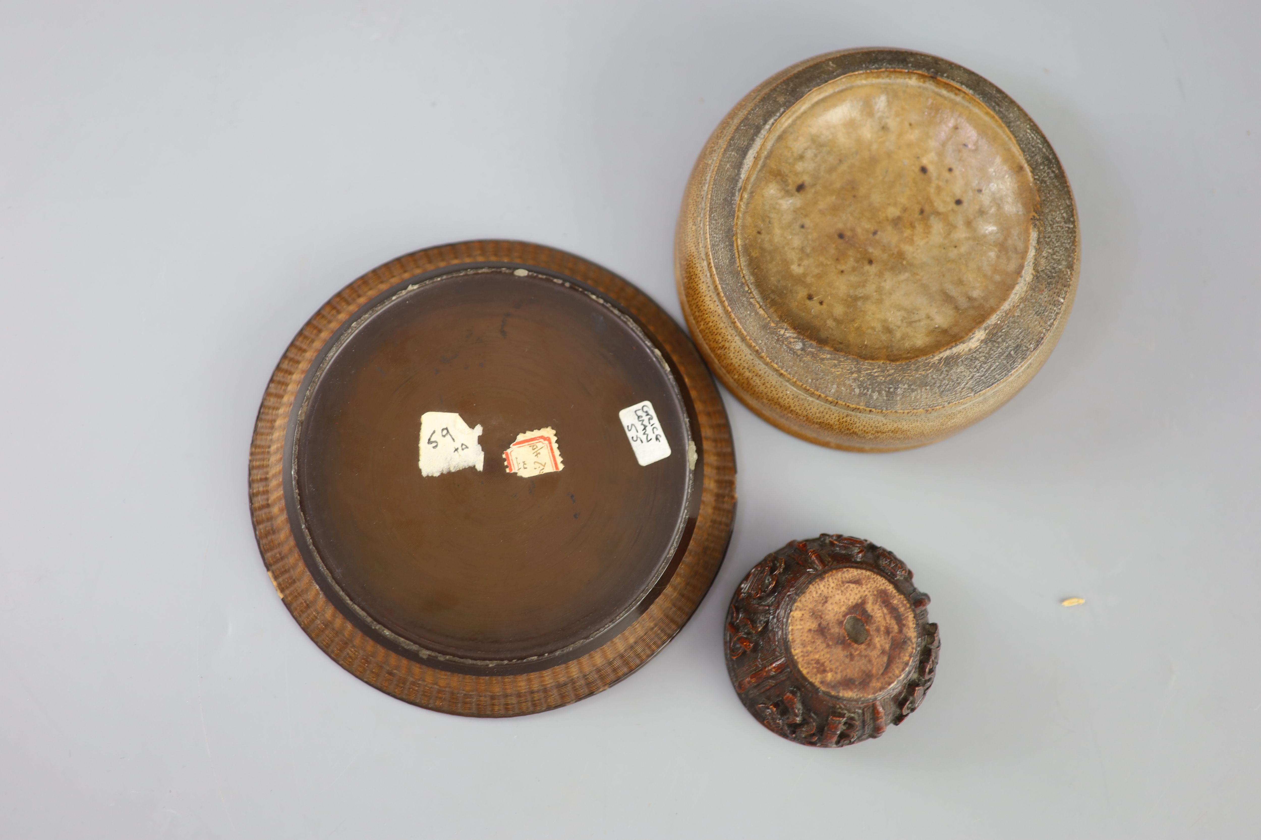 A Chinese carved bamboo cup, a plain bamboo brushwasher, 18th/19th century and a gilt decorated lacquer saucer dish, 17th century,
